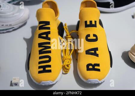 London, UK.  17 May 2021. Adidas NMD HU Pharrell Human Race 'Yellow', 2016, a collaboration between Adidas and musician Pharrell Williams. Preview of “Sneakers Unboxed: Studio to Street” at the Design Museum in Kensington.  The exhibition explores how sneakers have gone from being used for sport to cultural symbols and runs 18 May to 24 October 2021.  Credit: Stephen Chung / Alamy Live News Stock Photo