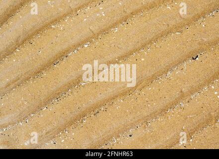 Ridge patterns on a sandy beach at St Annes, Lancashire, UK, caused by wave motion Stock Photo