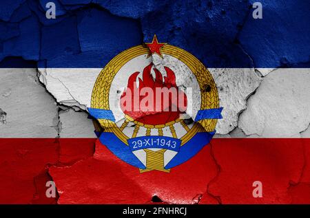 historical flag of Yugoslavia painted on cracked wall Stock Photo