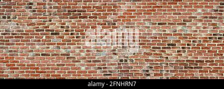 Panoramic rugged old red brown bricks wall. texture background Stock Photo