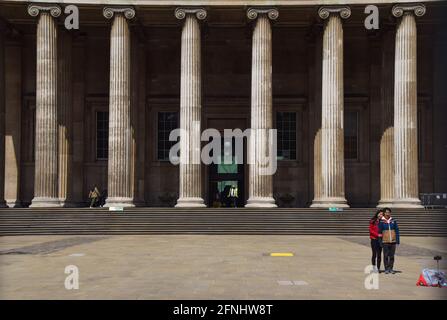 London, United Kingdom. 17th May 2021. Visitors take photos outside the British Museum. Museums and galleries reopened as further lockdown restrictions are lifted in England. Vuk Valcic / Alamy Live News