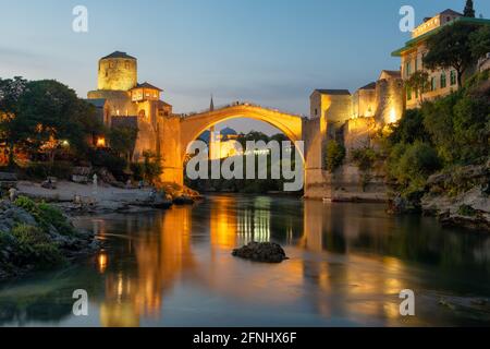 Stari Most bridge at night in old town of Mostar, BIH Stock Photo