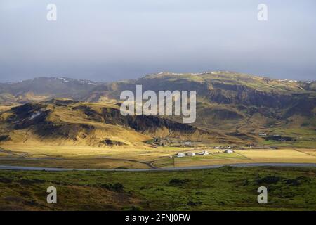 Area near Hveragerdi with mountains lit by the sun, South Iceland Stock Photo