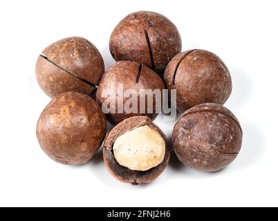 handful of macadamia nuts closeup on white background Stock Photo
