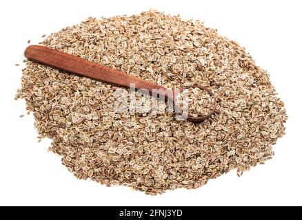 wooden spoon on pile of dill seeds on white background Stock Photo