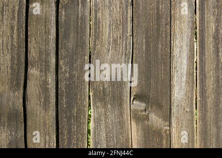 Closeup of wooden fence made of rough wood planks Stock Photo