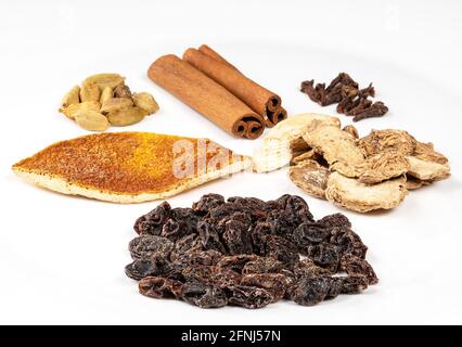 various Mulling spices closeup on white plate Stock Photo