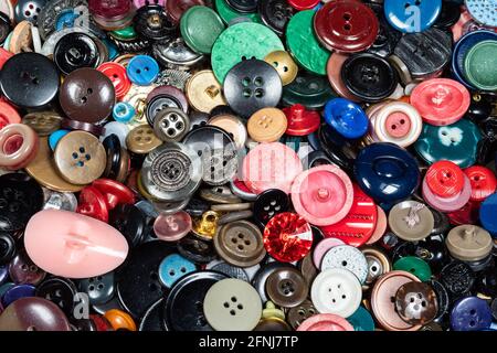 background from many various used buttons closeup Stock Photo