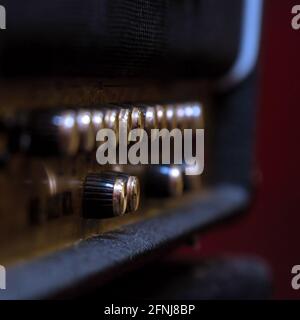 Knobs for volume, tone and various settings on the guitar amp. Guitar combo. Close up. Selective focus Stock Photo