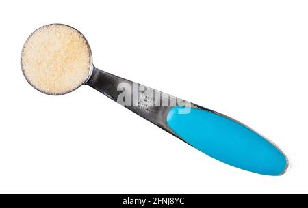 top view of crystalline beef gelatine in measuring spoon cutout on white background Stock Photo