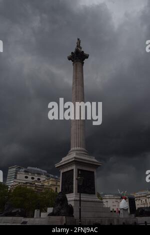 London, UK. 17th May, 2021. Dark clouds gather over Trafalgar Square moments before a thunderstorm in London. Credit: SOPA Images Limited/Alamy Live News Stock Photo