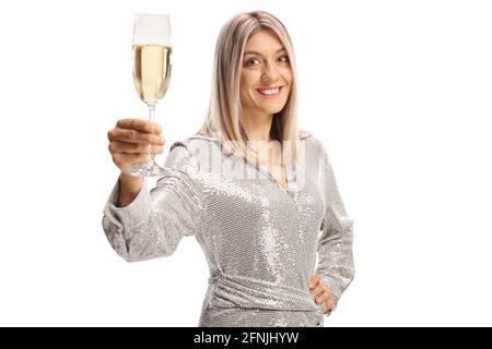 Elegant young woman in a dress toasting with a glass of sparkling wine isolated on white background Stock Photo