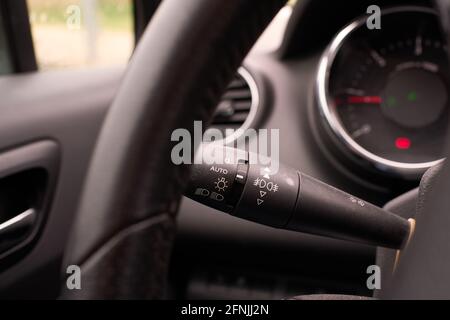 Car light control stick with indications for manual, automatic and fog lights Stock Photo