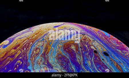 Beautiful psychedelic abstractions on the surface soap bubbles Stock Photo