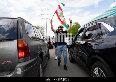 Dearborn, Michigan, USA. 15th May, 2021. A few thousand people gathered to rally against Israeli occupation and air raids on Palestinians in Dearborn, Michigan on May 15, 2021. The protest was organized by the Palestinian Youth Movement, and Dearborn is home to the largest Arab-American population in the U.S. Credit: Dominick Sokotoff/ZUMA Wire/Alamy Live News Stock Photo