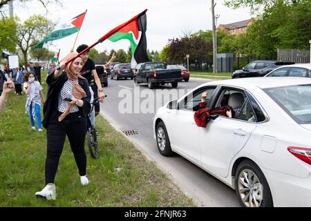 Dearborn, Michigan, USA. 15th May, 2021. A few thousand people gathered to rally against Israeli occupation and air raids on Palestinians in Dearborn, Michigan on May 15, 2021. The protest was organized by the Palestinian Youth Movement, and Dearborn is home to the largest Arab-American population in the U.S. Credit: Dominick Sokotoff/ZUMA Wire/Alamy Live News Stock Photo