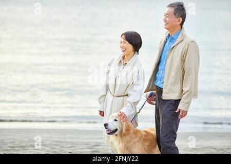 Senior Japanese couple at the beach Stock Photo