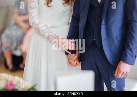 Bride and groom holding hands Stock Photo