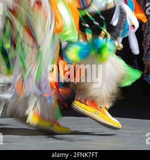 Indigenous dancer's feet and legs in slow motion at Elbow River Camp, a First Nations display which is part of the Calgary Stampede Stock Photo