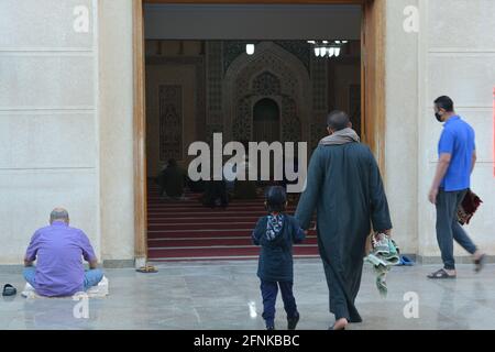 Muslims perform first Eid Al-Fitr prayers at mosques in Covid-19 pandemic era under the recent anti-coronavirus safety measures in large-sized mosques Stock Photo