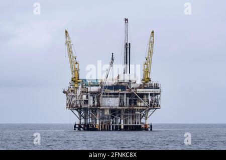 Ventura, California, USA - May 11, 2021:  Calm pacific ocean conditions at offshore oil drilling platform Gilda near the Channel Islands National Park