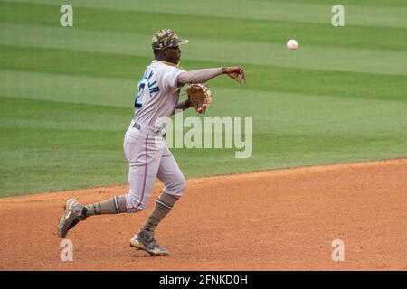 Miami Marlins' Jazz Chisholm loses his helmet as he runs to first base with  a single during the first inning of a baseball game against the New York  Yankees, Sunday, Aug. 1