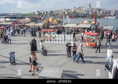 Istanbul, Turkey. 17th May, 2021. People seen walking at Eminonu district.After 3 weeks of lock down, citizens threw themselves into the street. In Istanbul, both vehicle and pedestrian traffic was intense. Turkey emerged from a 17-day-long lockdown on May 17 and moved to a period of gradual lifting that will last until June 1. (Photo by Ibrahim Oner/SOPA Images/Sipa USA) Credit: Sipa USA/Alamy Live News Stock Photo