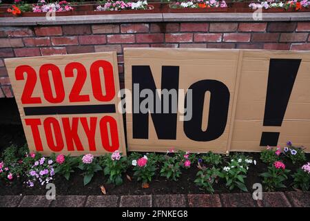 Tokyo, Japan. 17th May, 2021. '2020 Tokyo No!' seen during an anti Tokyo 2020 Olympic Games Rally in Ginza district.Around 30 to 40 protesters took to the streets calling for the cancelation of the Olympic Games this summer. They were accompanied by the same number of police officers. Protesters went from Shinbashi station through the Ginza district to the Head Office of the Organization Committee for the Games. (Photo by Stanislav Kogiku/SOPA Images/Sipa USA) Credit: Sipa USA/Alamy Live News Stock Photo