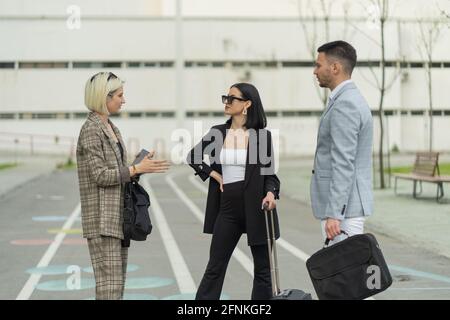 Three business people are discussing the plans about the company Stock Photo