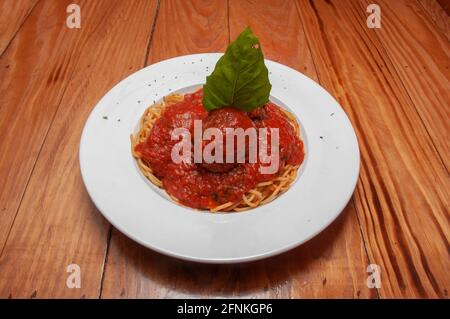 Heaping bowl full of delicious spaghetti and meatballs Stock Photo