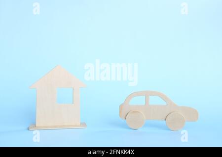 House versus car ownership concept. Priority dilemma on choosing between buying a house or a car. Stock Photo