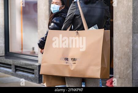 Shopper seen carry Burberry merchandiser bag. The Prime Minister announced  that England can proceed to Stage Three on May 17, 2021. Most shops can  reopen including indoor. (Photo by May James /