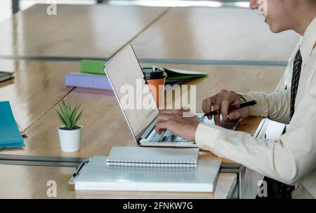 Office business team concept. Happy Young Asian video conference meeting using laptop with teammates Stock Photo