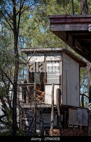 An ancient derelict cubby house on stilts in the bush Stock Photo