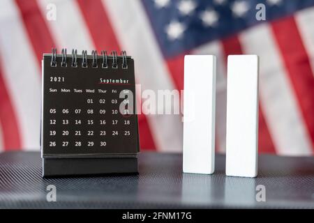 Remembering 9 11, Patriot day, remember 11 September. USA flag with the twin towers background. We will never forget, the terrorist attacks of 2021 Stock Photo