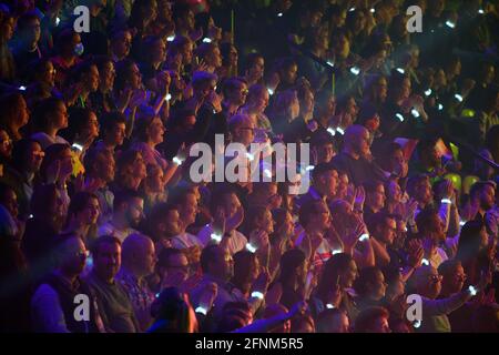 Rotterdam, Netherlands. 17th May, 2021. Spectators with glowing wristbands sit during the second dress rehearsal of the first semi-final of the Eurovision Song Contest (ESC) at the Ahoy Arena. Credit: Soeren Stache/dpa-Zentralbild/dpa/Alamy Live News Stock Photo