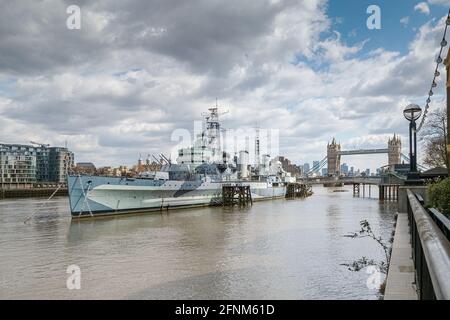 A view of Royal naval ship HMS Belfast from Queens Walk on the Southbank of the river Thames Stock Photo