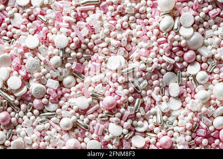 Closeup of colourful sugar sprinkles, cake decor. Top view Stock Photo
