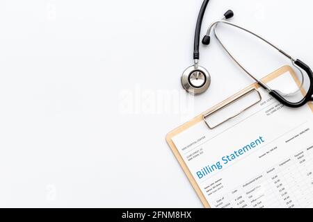 Stethoscope with medical billing statement. Top view Stock Photo