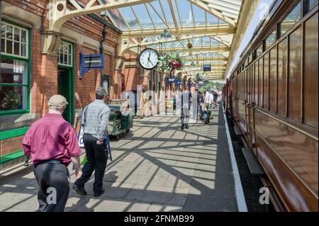 On the platform at Loughborough Station, part of the Great Central Railway, UK; passengers boarding a steam train. Stock Photo