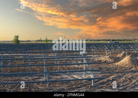 Metal structure for mounting photovoltaic panels. Solar farm Stock Photo