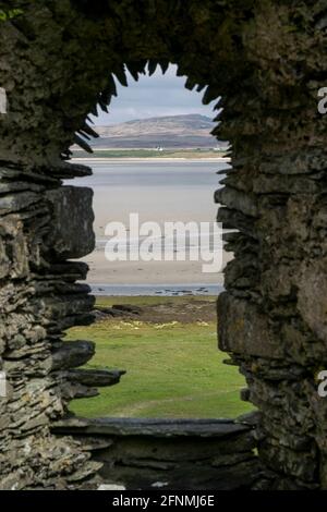 Kilnave Chapel and Cross situated on the west bank of Loch Gruinart, Isle of Islay, Inner Hebrides, Scotland. Stock Photo