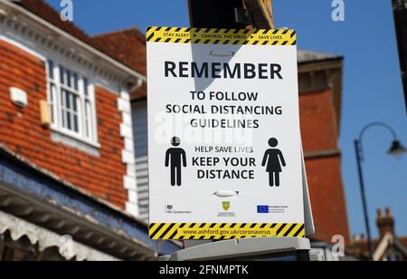 A Coronavirus social distancing sign at Tenterden in Kent, England on  April 4, 2021. Stock Photo