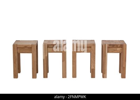 Set of four oak stools. Kitchen chairs made of wood. Stock Photo
