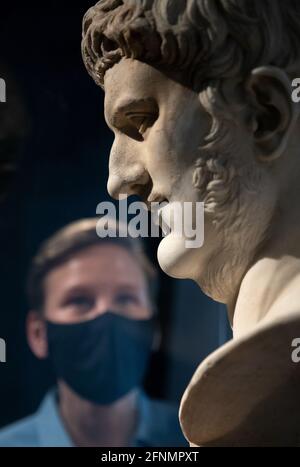 Francesca Bologna, Project Curator of 'Nero: the man behind the myth', inspects a marble head of Nero (AD 50Ð100), on loan from the Musei Capitolini in Rome, ahead of the opening of the exhibition on the Roman Emperor Nero on 27th May at the British Museum, London. Picture date: Tuesday May 18, 2021. Picture date: Tuesday May 18, 2021. Stock Photo