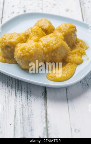 Vertical shot of meatballs in vegetable sauce with white wine Stock Photo