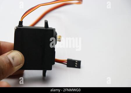 Metal servo with close-up of metal geared shaft. Metal geared servo for robotic projects controlled by micro controller Stock Photo