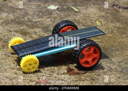 Solar powered car (working model) built at home small in size and use to understand the working principle of actual solar car which runs using solar e Stock Photo