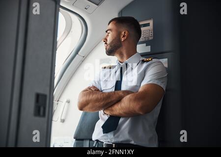 Curious pilot checking the weather before the flight Stock Photo