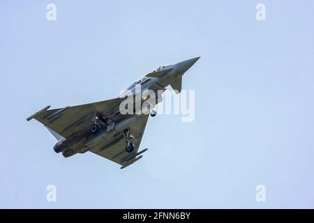 RAF Coningsby, Lincolnshire, UK. 18th May, 2021. An RAF Typhoon Eurofighter takes off from RAF Coningsby, Lincolnshire, on touch-and-go exercises. Credit: Peter Lopeman/Alamy Live News Stock Photo